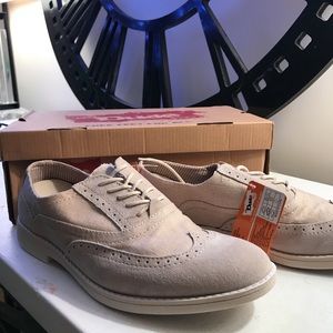 Cream wingtips. Classy comfort